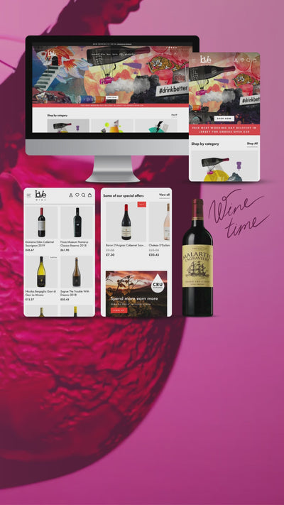 laptop /  phone screen video showing examples of Love Wine website with selection of bottles of wine and a wine glass being filled in background.